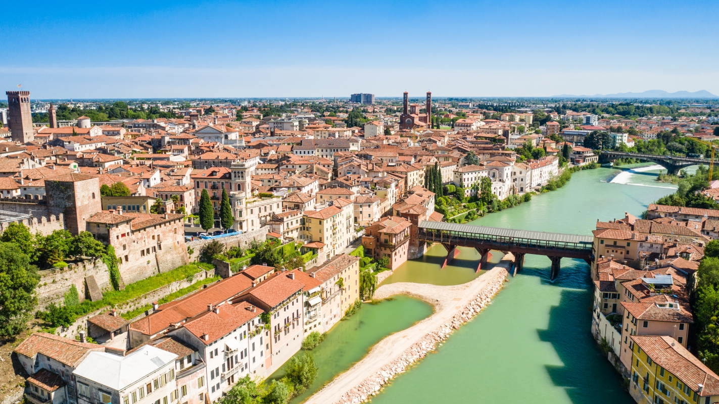 Aerial view of Bassano del Grappa with the Ponte degli Alpini over the Brenta river - ENIT SpA