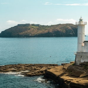 Ventotene lighthouse; in the background, the Bourbon prison of Santo Stefano - ENIT SpA